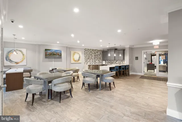 a living room with lots of furniture and a wooden floor