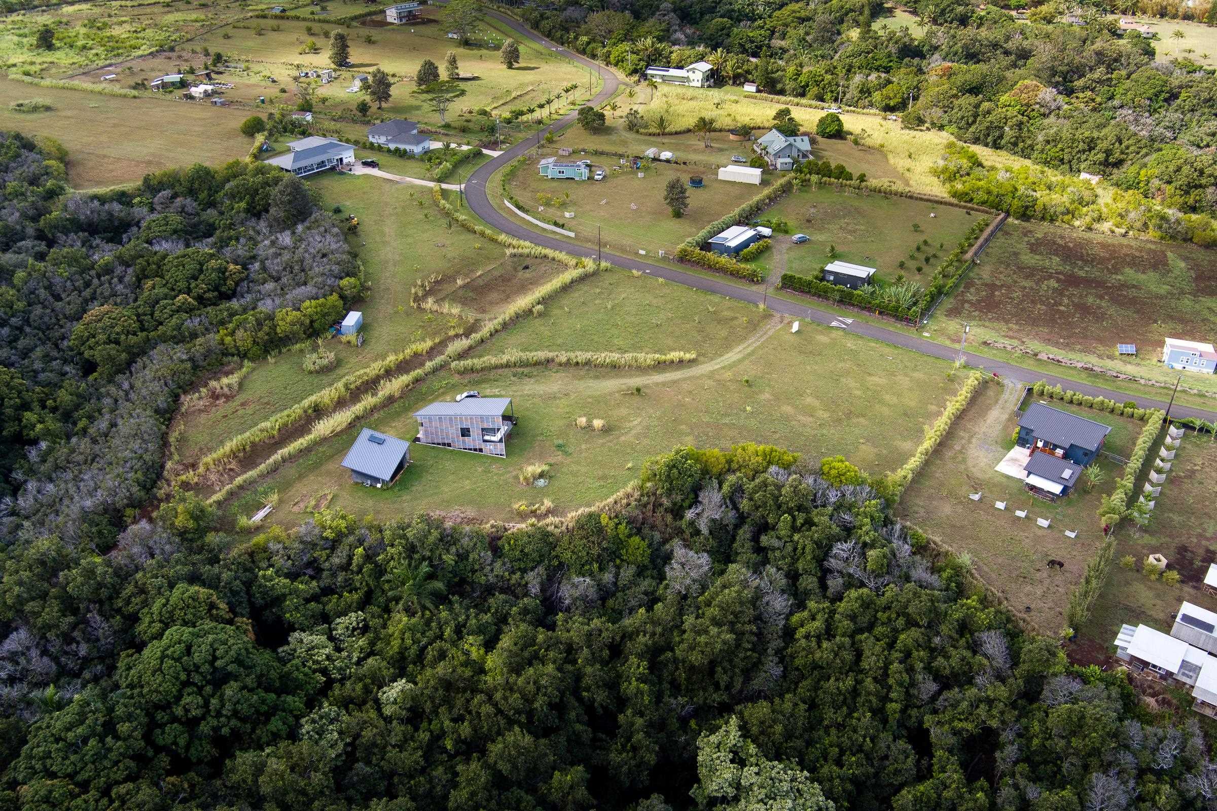 674 Kauaheahe Place, Unit A Haiku, HI 96708 - Photo 16 of 21 an aerial view of residential houses with outdoor space