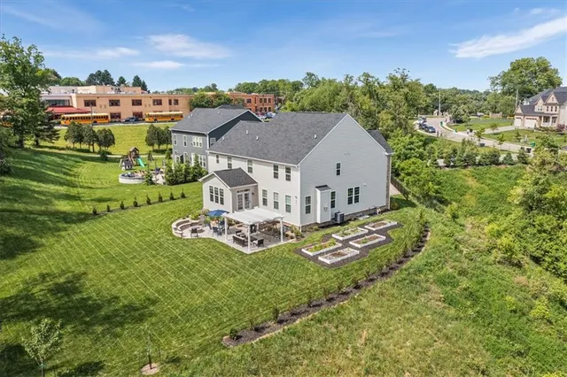 an aerial view of a house with garden