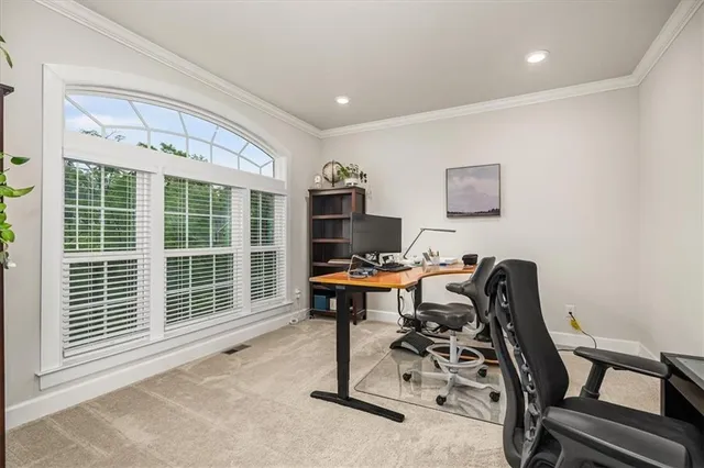 a workspace with furniture and a window