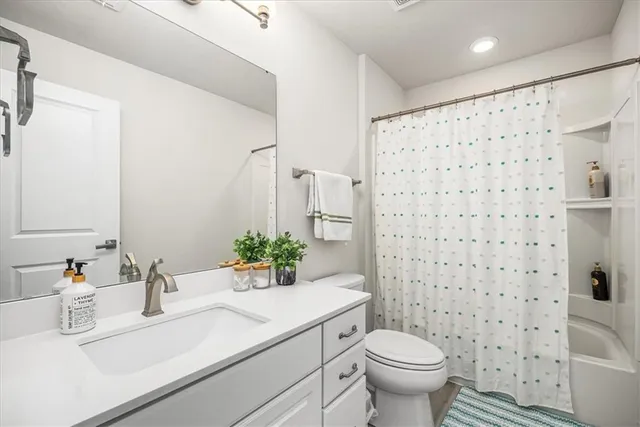 a kitchen with a sink window and cabinets