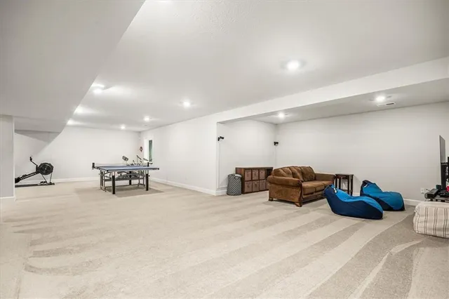 a bathroom with a toilet sink and a mirror