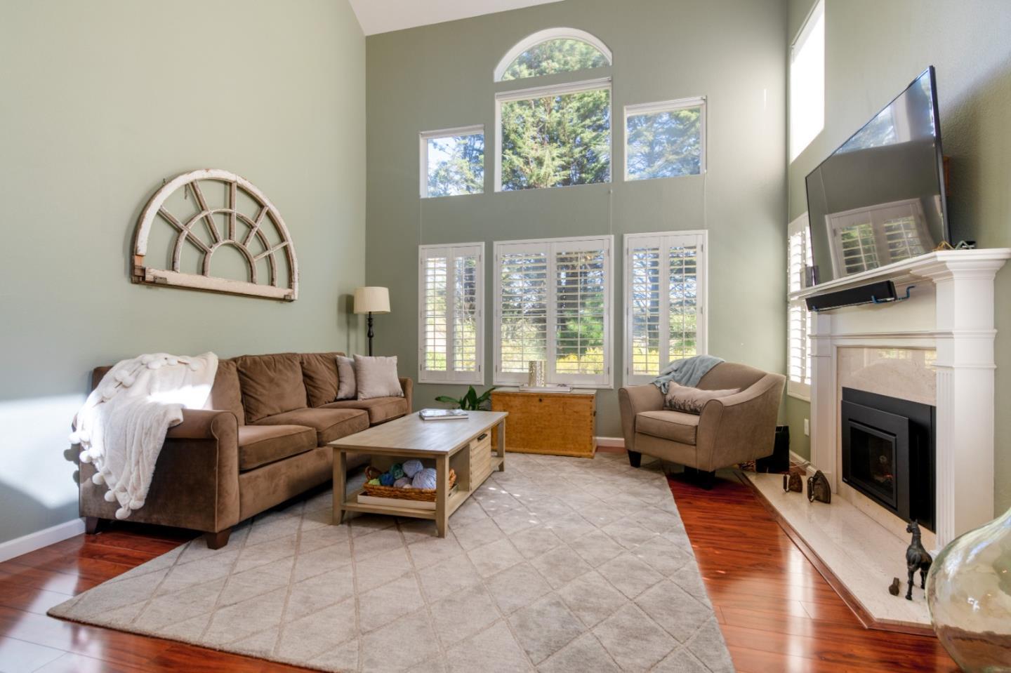 132 Patrick Way Half Moon Bay, CA 94019 - Photo 1 of 22 a living room with furniture a fireplace and a flat screen tv