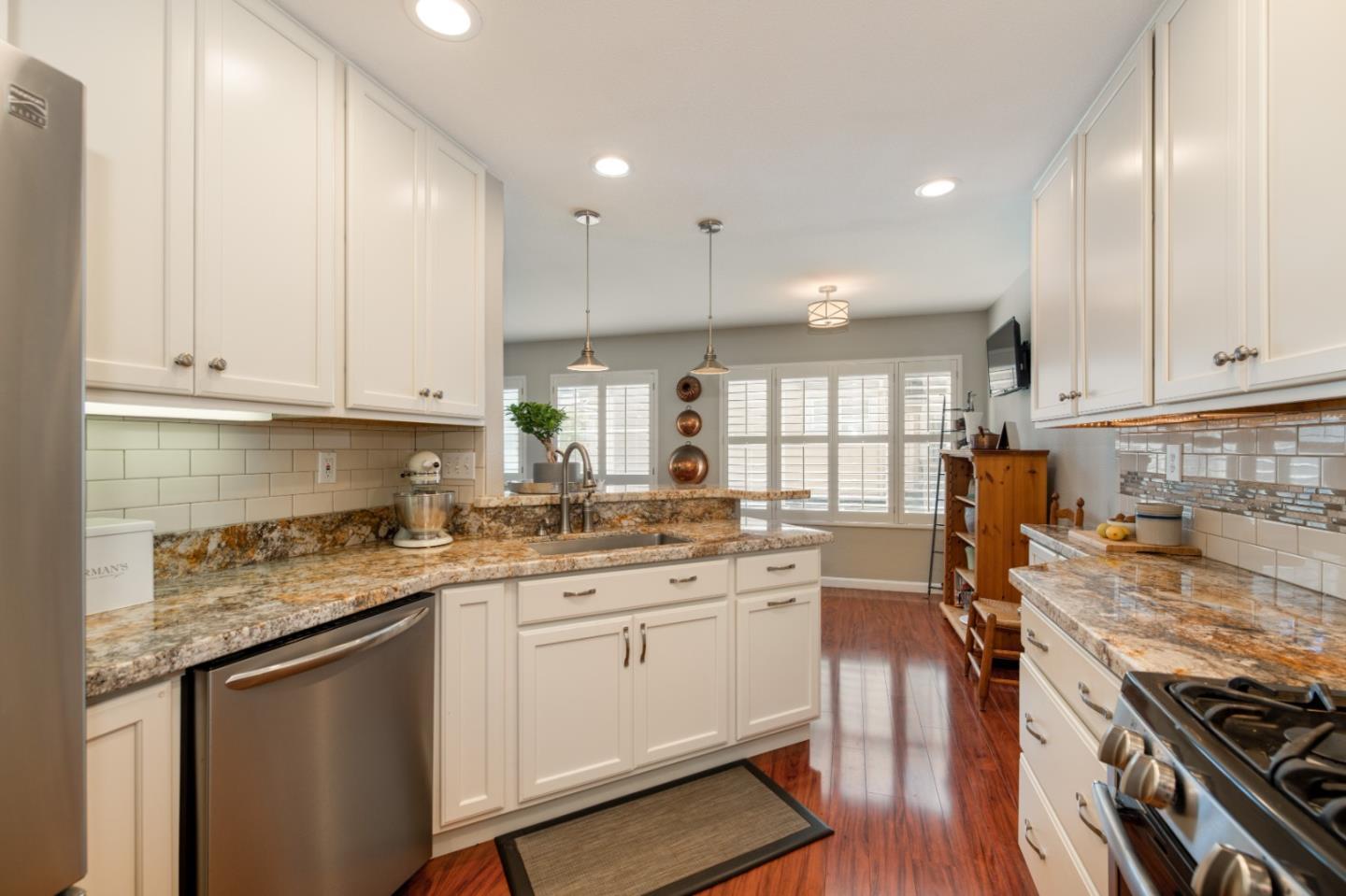132 Patrick Way Half Moon Bay, CA 94019 - Photo 11 of 22 a kitchen with a sink stove and cabinets