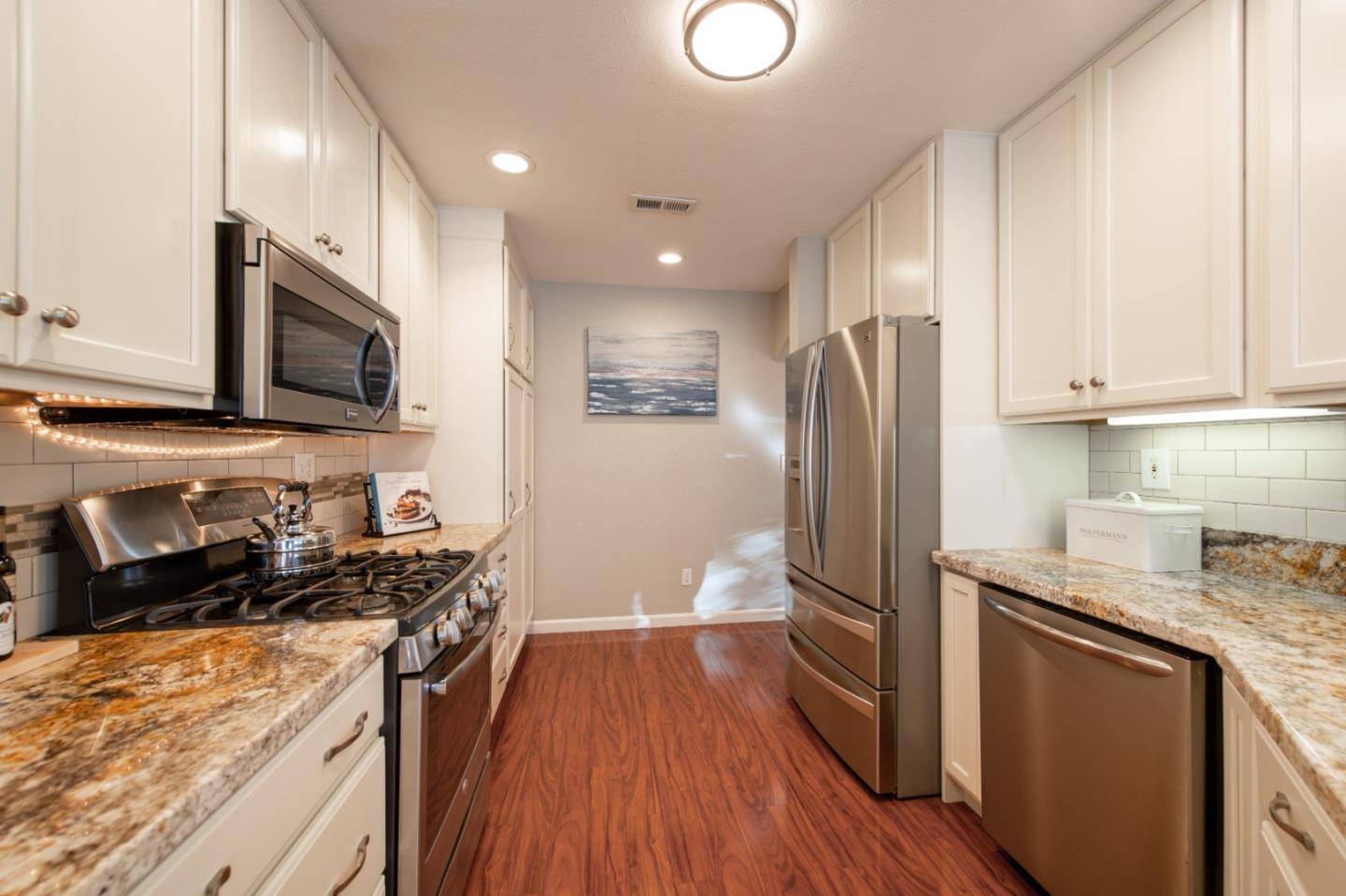 132 Patrick Way Half Moon Bay, CA 94019 - Photo 12 of 22 a kitchen with stainless steel appliances granite countertop a refrigerator stove microwave and sink