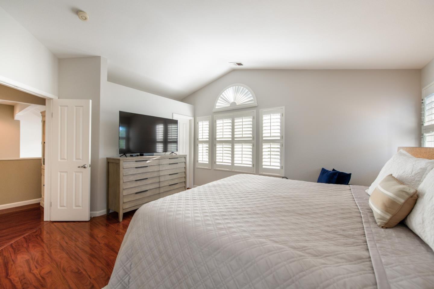 132 Patrick Way Half Moon Bay, CA 94019 - Photo 15 of 22 a bedroom with a bed and a flat screen tv