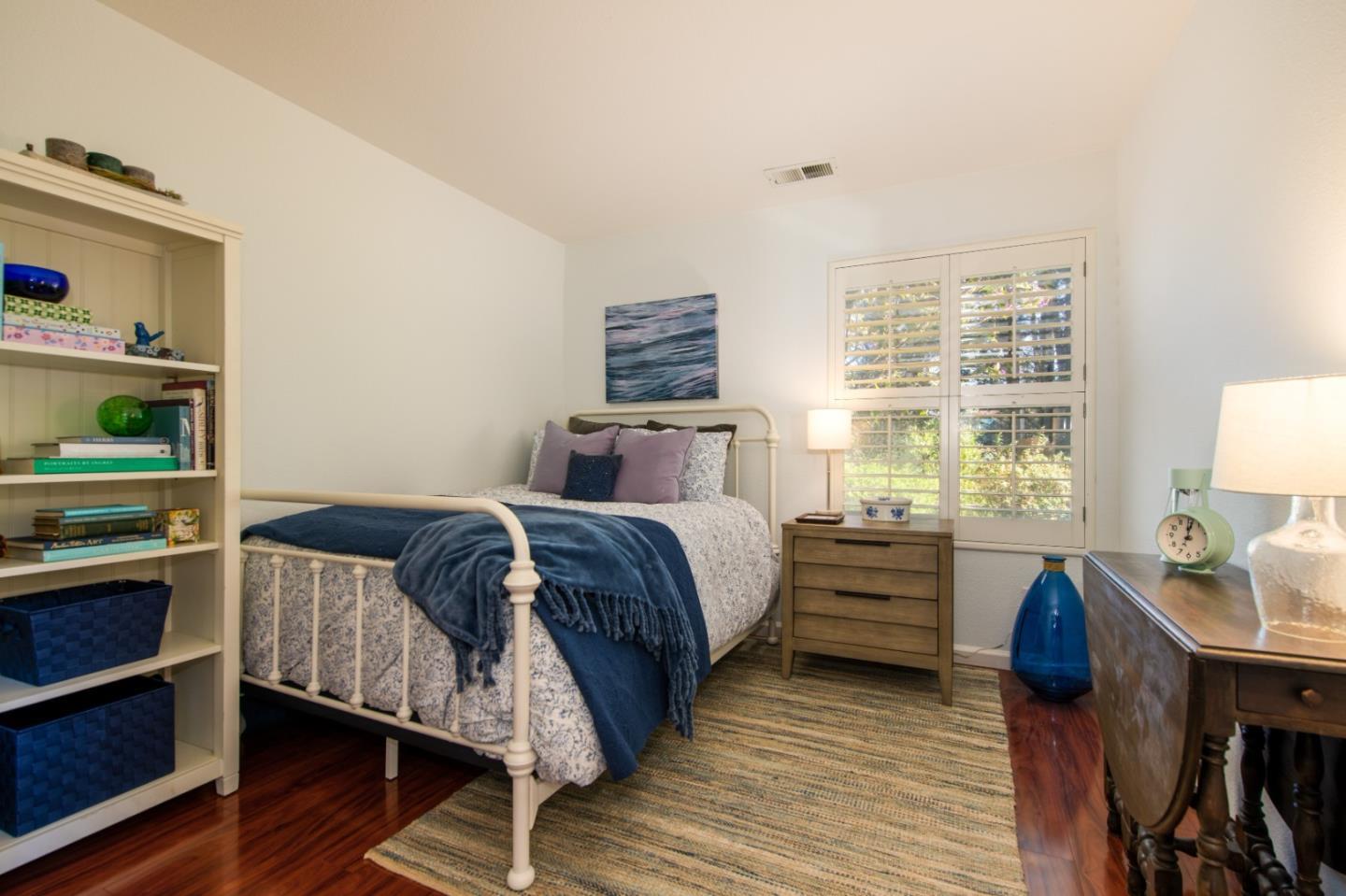 132 Patrick Way Half Moon Bay, CA 94019 - Photo 17 of 22 a bedroom with a bed and a window