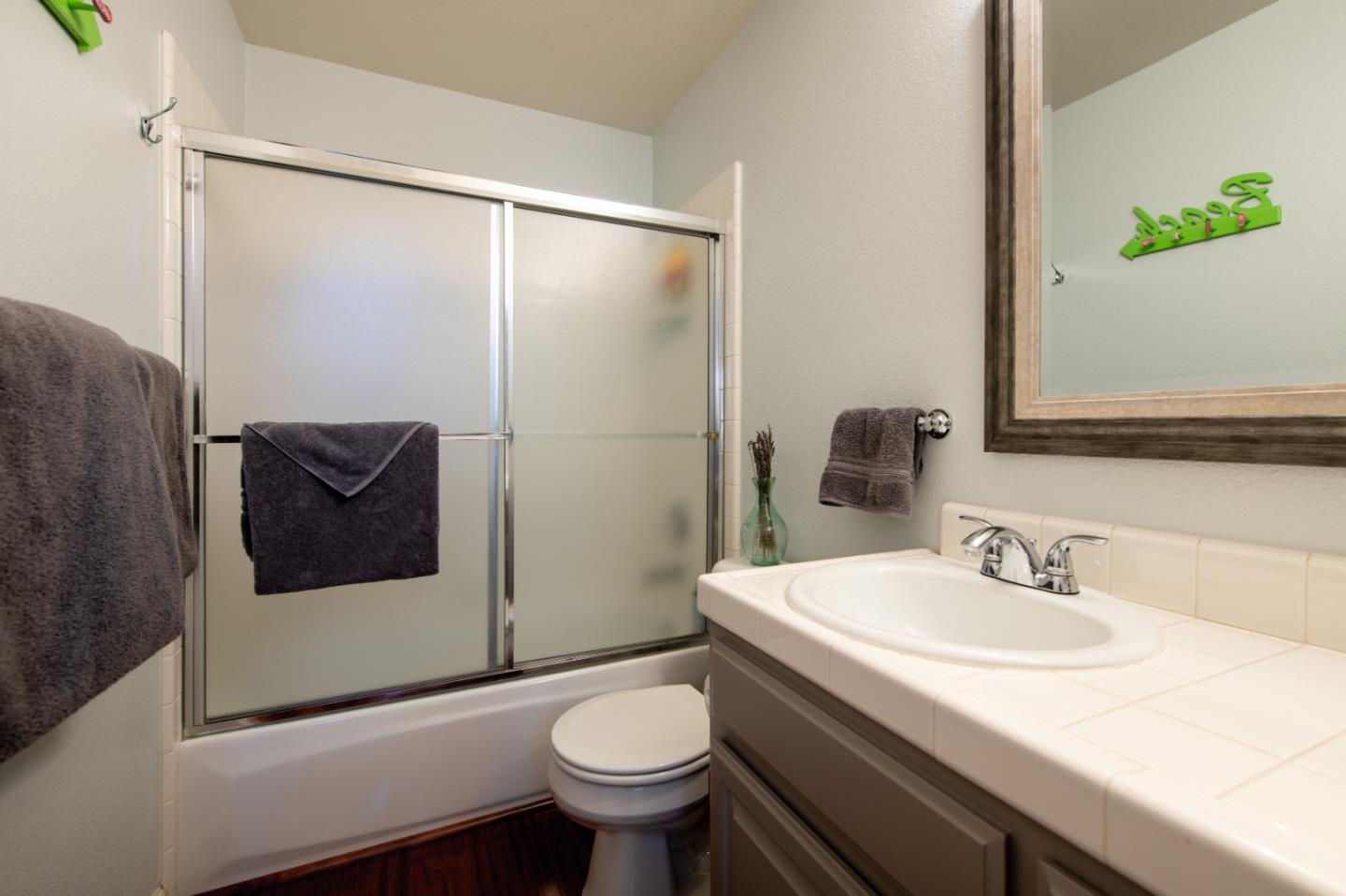 132 Patrick Way Half Moon Bay, CA 94019 - Photo 20 of 22 a bathroom with a sink and a mirror