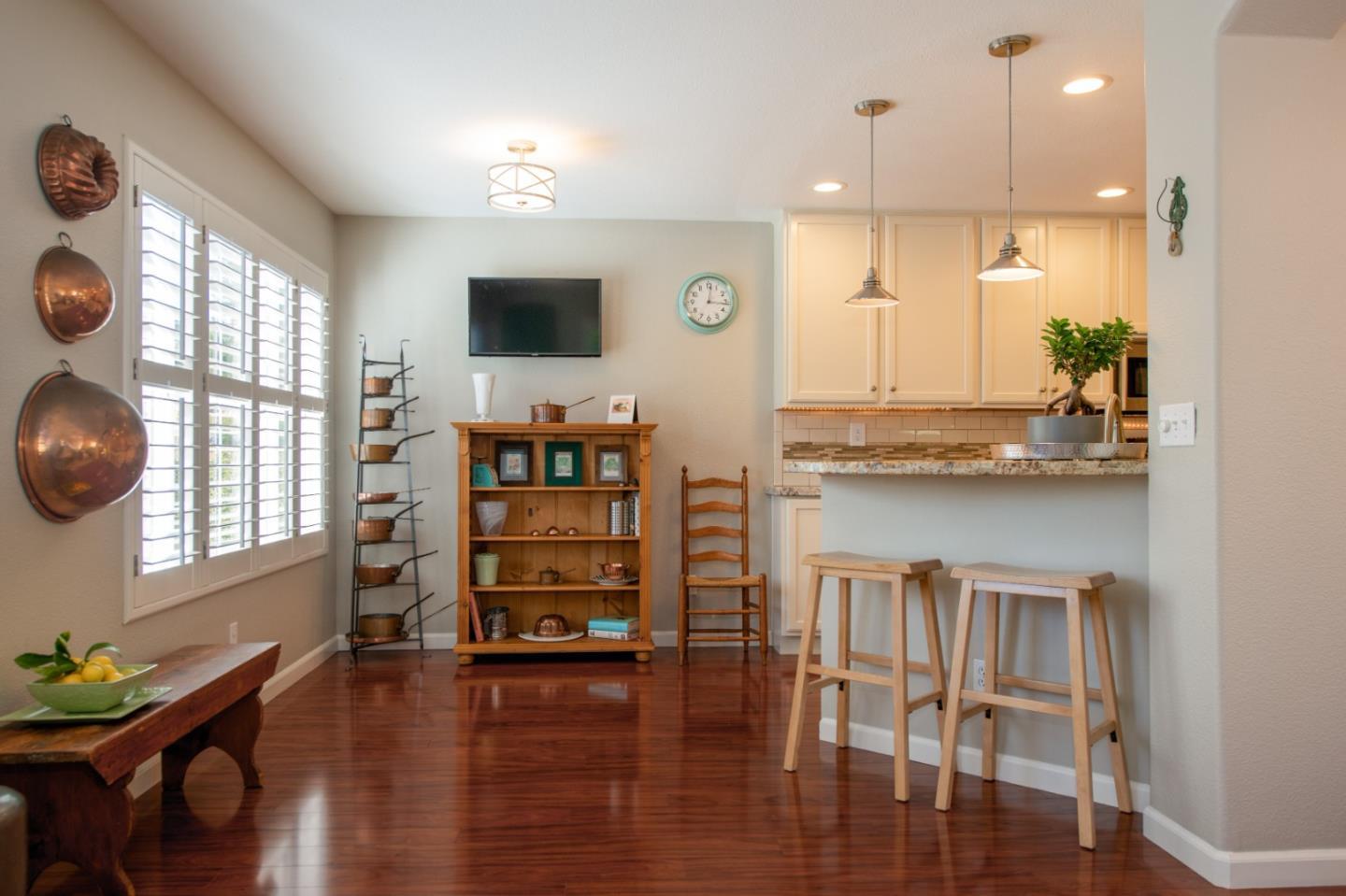 132 Patrick Way Half Moon Bay, CA 94019 - Photo 9 of 22 a view of kitchen with stainless steel appliances granite countertop a stove top oven a sink with wooden floors