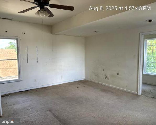6 Parkwood Road Baltimore, MD 21222 - Photo 11 of 30 an empty room with a ceiling fan and window