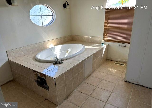 6 Parkwood Road Baltimore, MD 21222 - Photo 13 of 30 a bathroom with a sink a vanity and a mirror