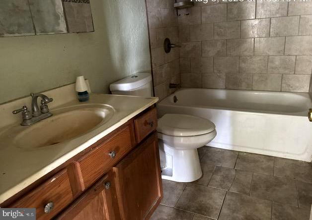 6 Parkwood Road Baltimore, MD 21222 - Photo 18 of 30 a bathroom with a sink and a toilet