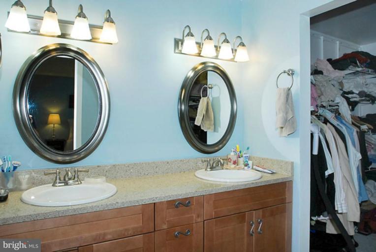 2419 Glade Bank Way Reston, VA 20191 - Photo 14 of 29 a bathroom with a sink and a mirror