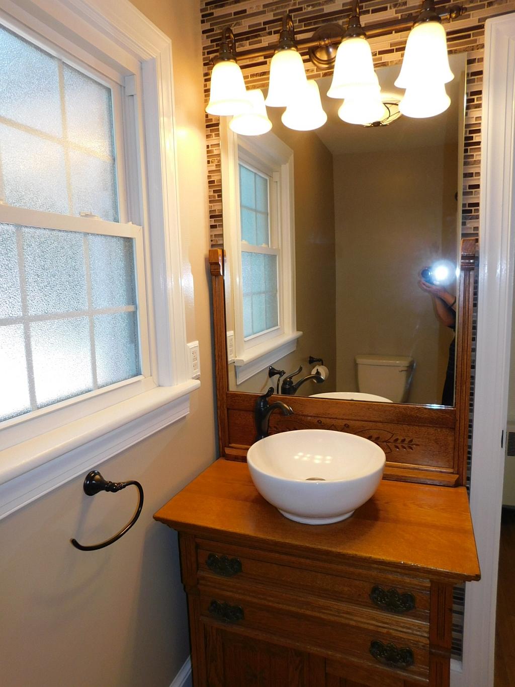 3788 Callaway Road Boones Mill, VA 24065 - Photo 14 of 32 a bathroom with a sink a mirror and a window