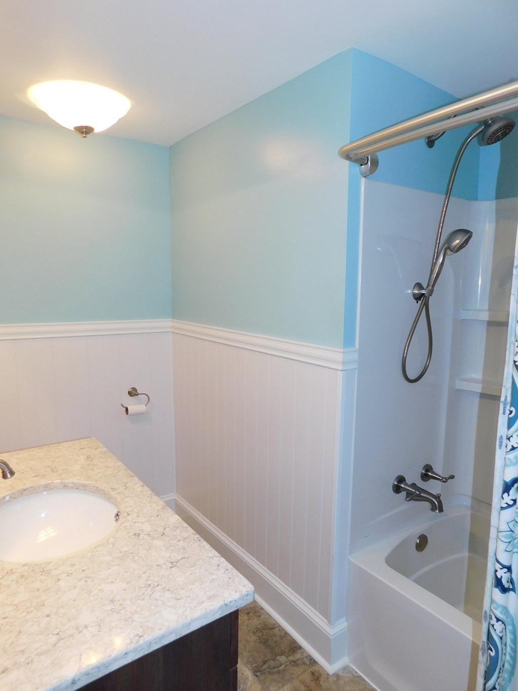 3788 Callaway Road Boones Mill, VA 24065 - Photo 22 of 32 a bathroom with a granite countertop sink and a bathtub