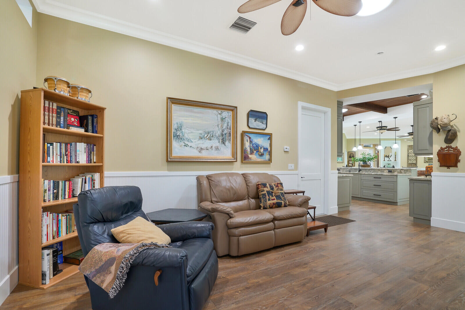 6624 Dillman Road Greenacres, FL 33413 - Photo 32 of 65 a living room with furniture and a book shelf