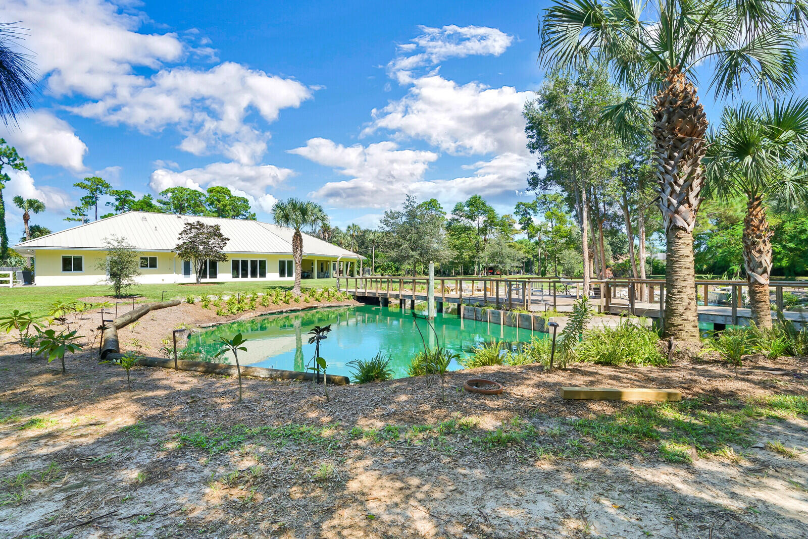 6624 Dillman Road Greenacres, FL 33413 - Photo 43 of 65 a view of a lake with a houses