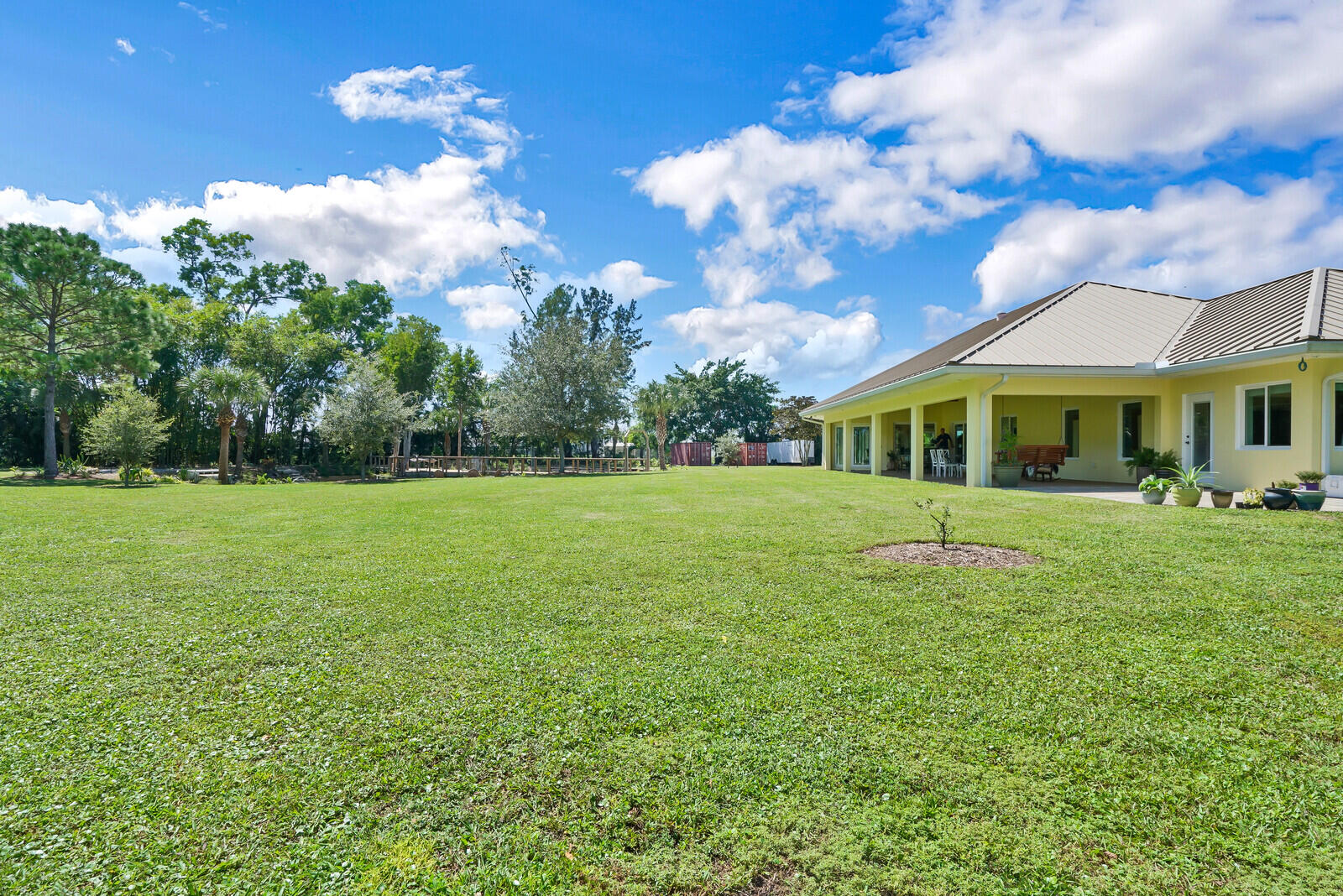 6624 Dillman Road Greenacres, FL 33413 - Photo 46 of 65 a view of house with a big yard