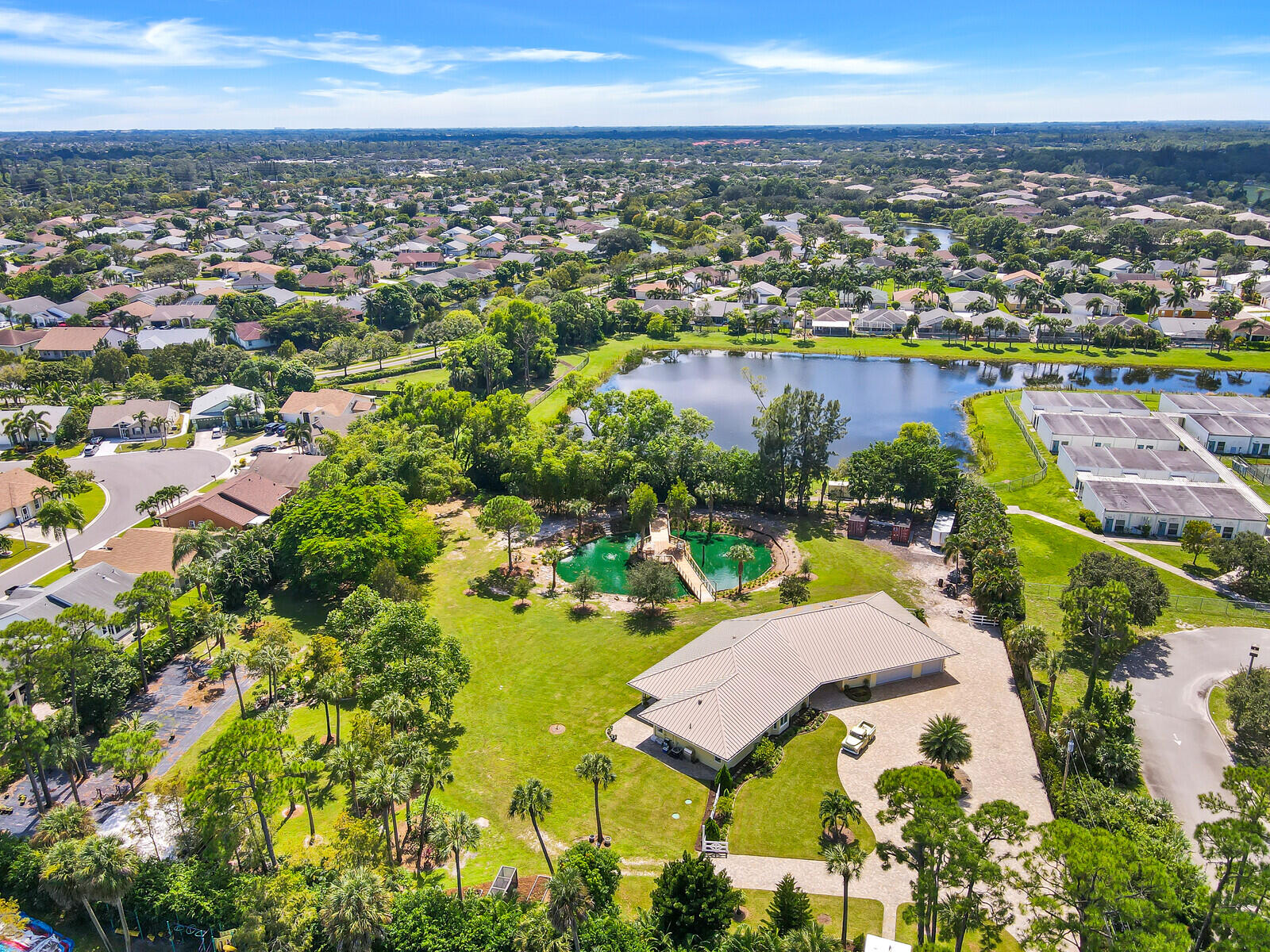 6624 Dillman Road Greenacres, FL 33413 - Photo 53 of 65 an aerial view of residential houses with outdoor space