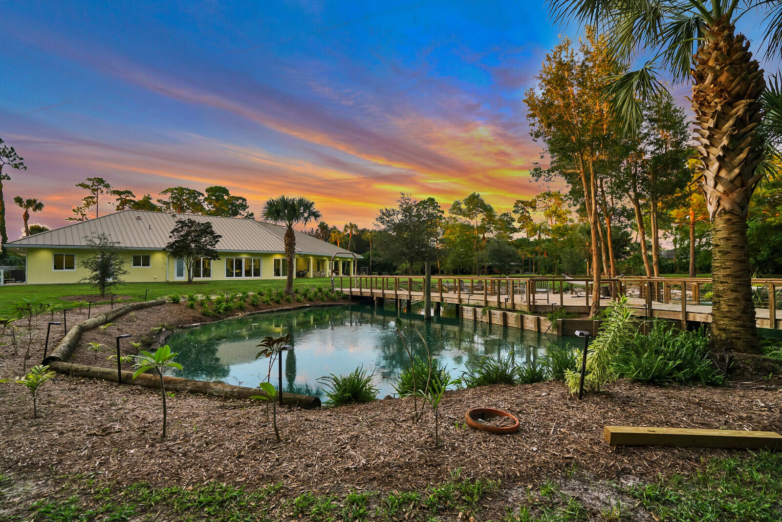 6624 Dillman Road Greenacres, FL 33413 - Photo 60 of 65 a view of a lake with houses