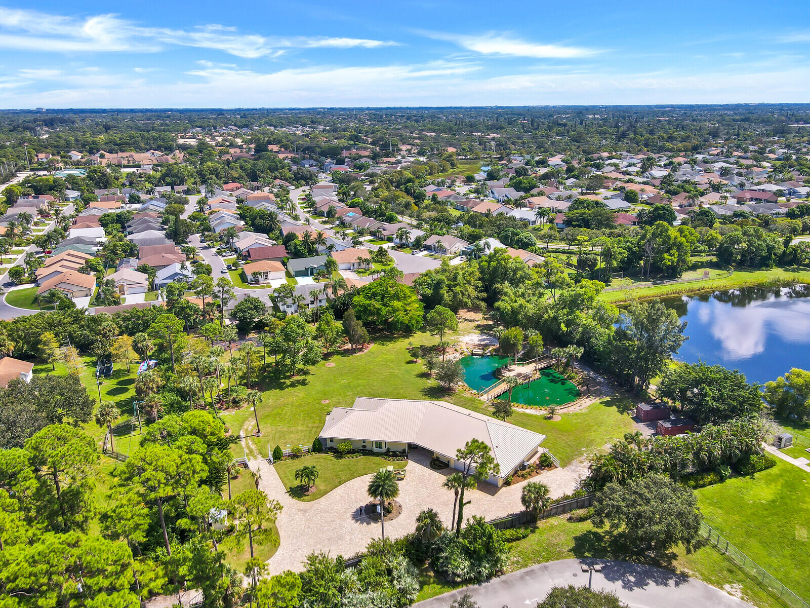 6624 Dillman Road Greenacres, FL 33413 - Photo 65 of 65 an aerial view of residential houses with outdoor space