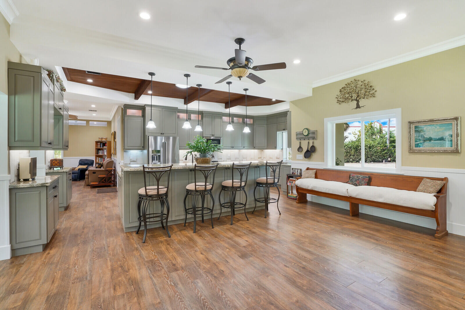 6624 Dillman Road Greenacres, FL 33413 - Photo 9 of 65 a dining hall with stainless steel appliances granite countertop a couch dining table chairs and view living room