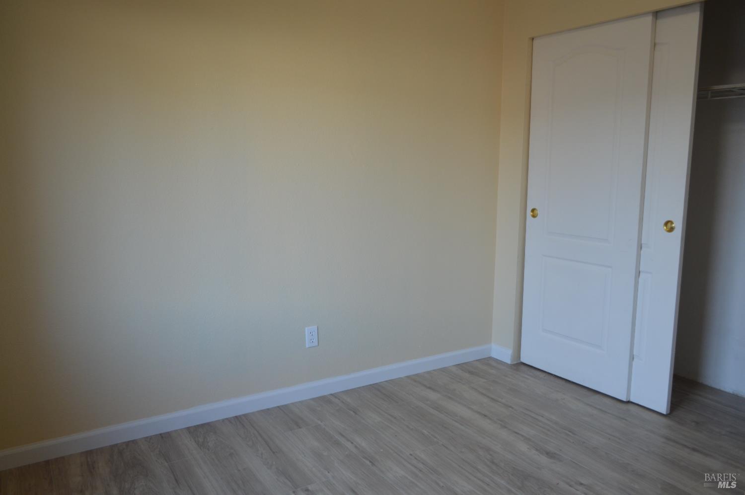 3900 North State Street, Unit 75 Ukiah, CA 95482 - Photo 17 of 22 a view of an empty room with wooden floor