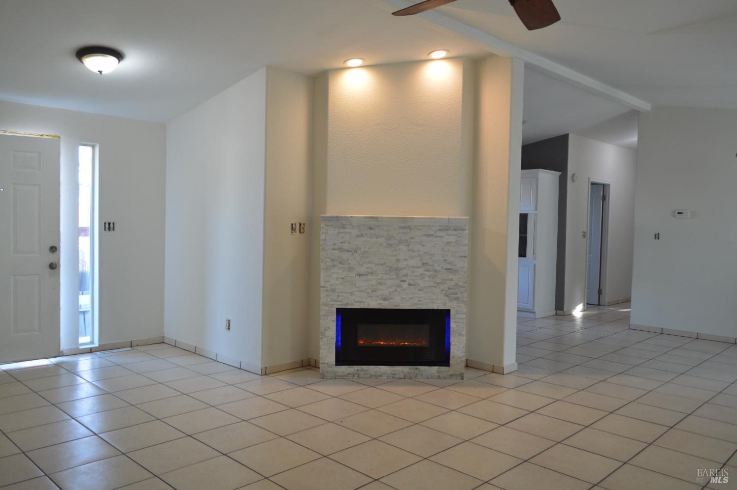 3900 North State Street, Unit 75 Ukiah, CA 95482 - Photo 5 of 22 an empty room with fireplace