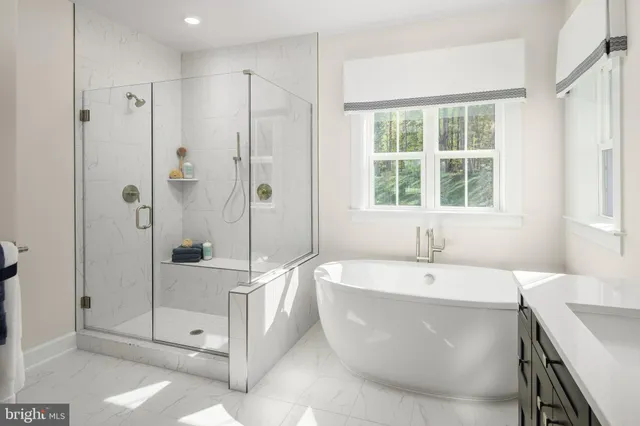 a spacious bathroom with a tub shower and sink
