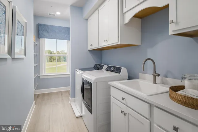 a view of bathroom with dual sinks