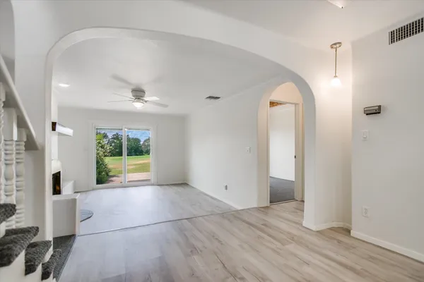 a view of livingroom with fireplace and wooden floor