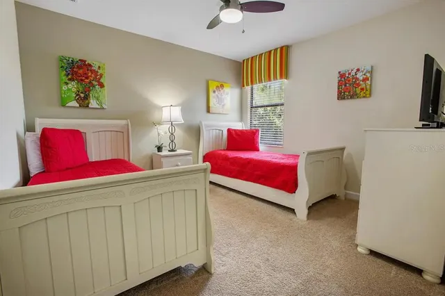 a living room with furniture and painting on the wall