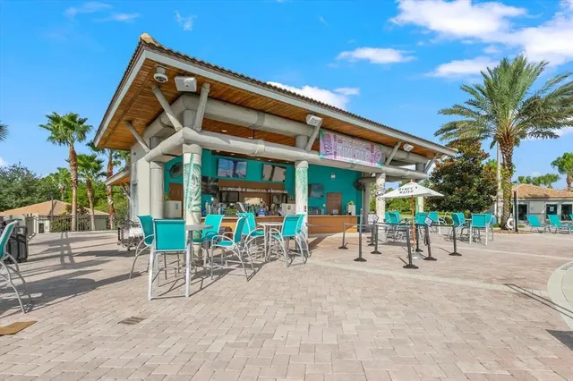 a view of a backyard with sitting area