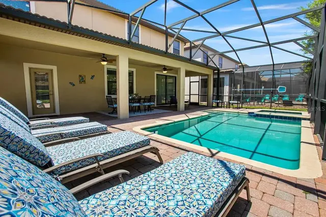 a view of a patio with chairs and tables