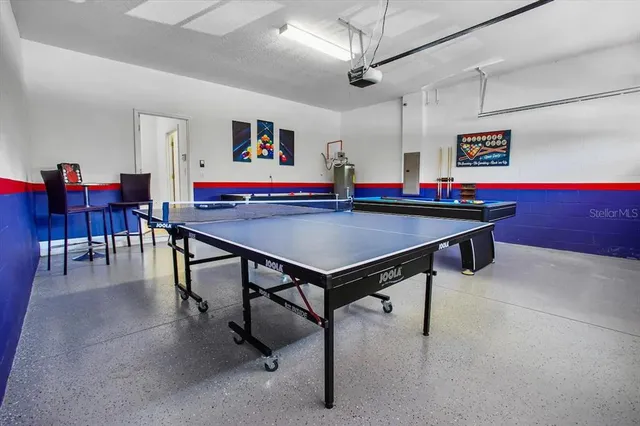 a living room with fireplace furniture and a chandelier