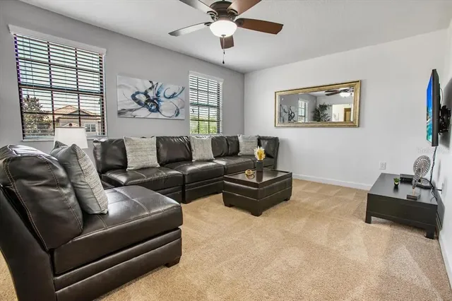 a living room with furniture and a window