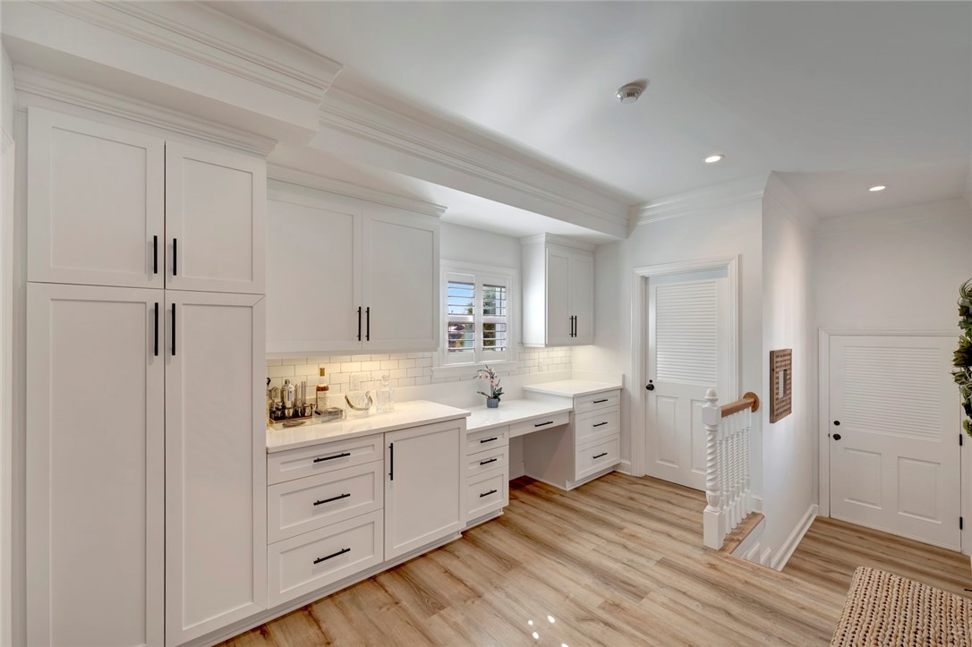 176 Ocean Way Vero Beach, FL 32963 - Photo 13 of 36 a kitchen with a sink cabinets and wooden floor