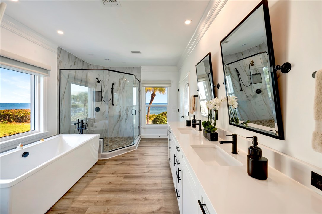 176 Ocean Way Vero Beach, FL 32963 - Photo 18 of 36 a large spacious bathroom with a tub double vanity and a shower