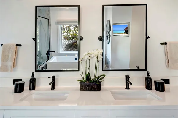 a bathroom with sink and a mirror