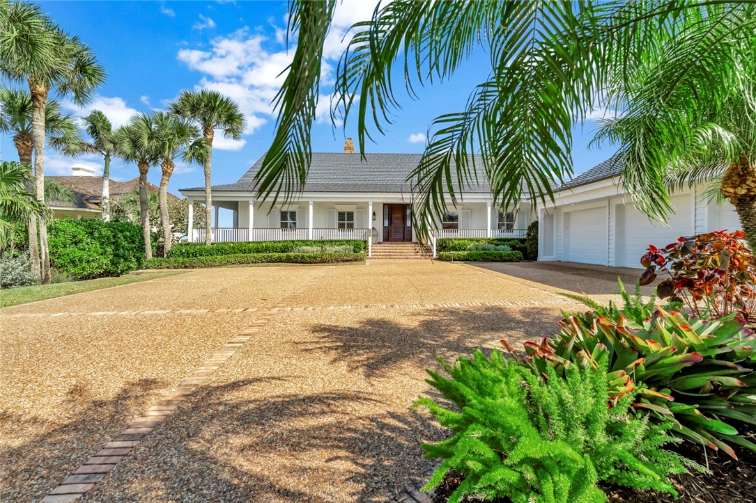 176 Ocean Way Vero Beach, FL 32963 - Photo 2 of 36 a front view of house with yard and green space