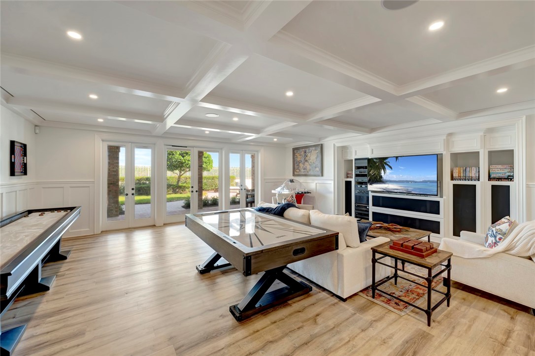176 Ocean Way Vero Beach, FL 32963 - Photo 22 of 36 a living room with furniture a rug and a flat screen tv