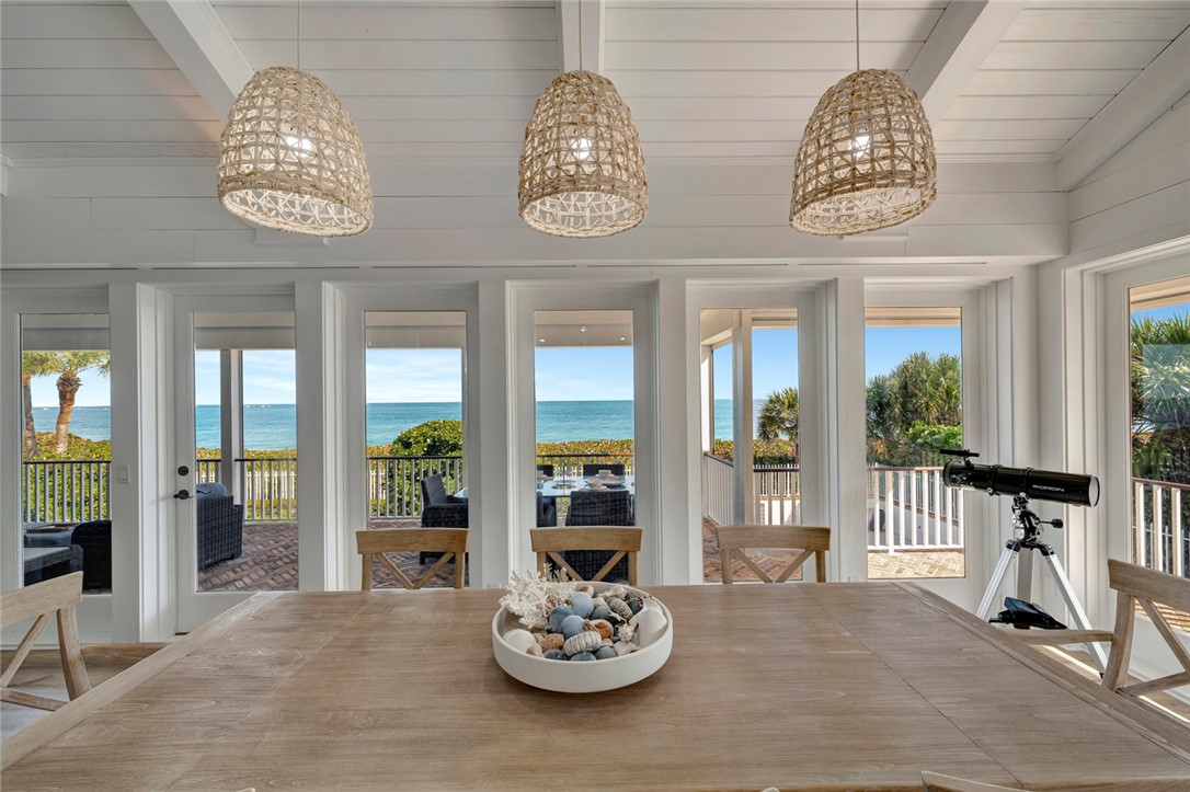 176 Ocean Way Vero Beach, FL 32963 - Photo 9 of 36 a view of a chandelier and dining table in a room