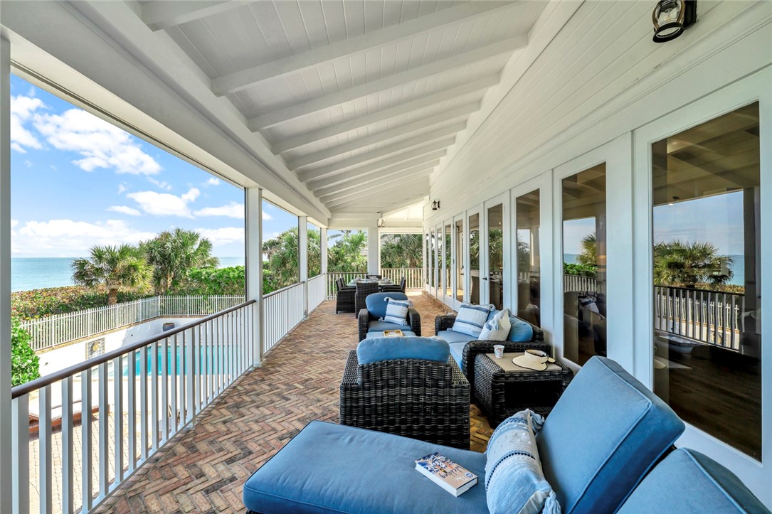 176 Ocean Way Vero Beach, FL 32963 - Photo 10 of 36 a living room with patio furniture and garden view