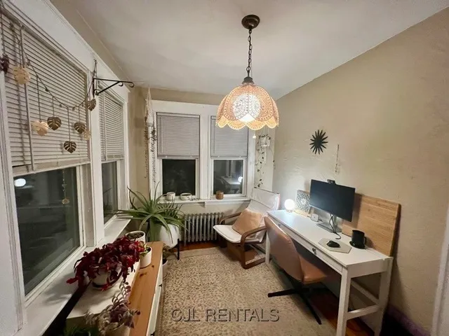 a view of a livingroom with furniture and a window