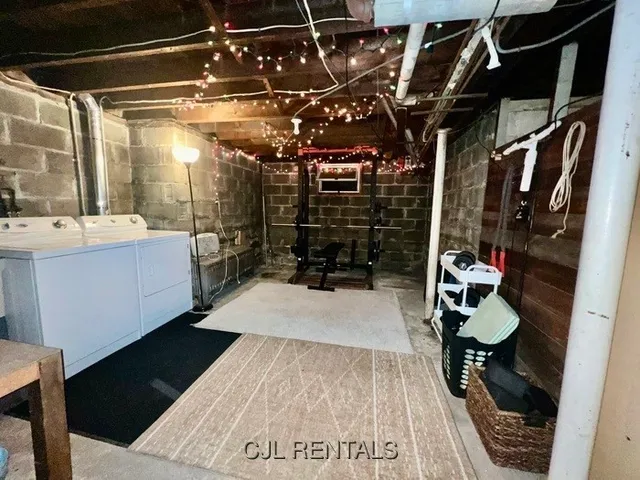 a room with lots of wooden furniture and a shower