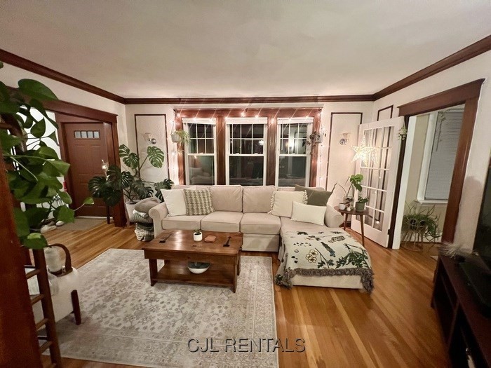 33 Evans Street, Unit 1 Watertown, MA 02472 - Photo 4 of 14 a living room with furniture and a large window