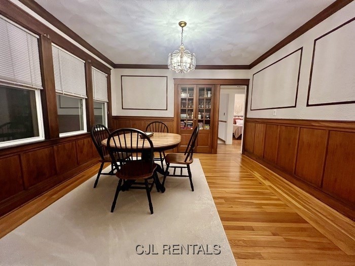 33 Evans Street, Unit 1 Watertown, MA 02472 - Photo 5 of 14 a view of a dining room with furniture window and wooden floor