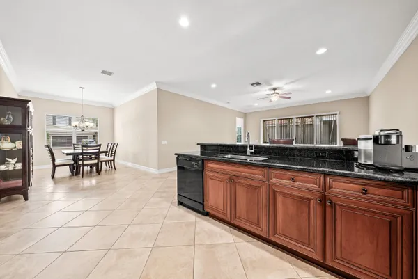 a kitchen with stainless steel appliances granite countertop a sink and a counter top space
