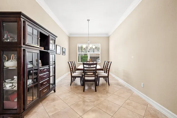 a dining room with furniture and window