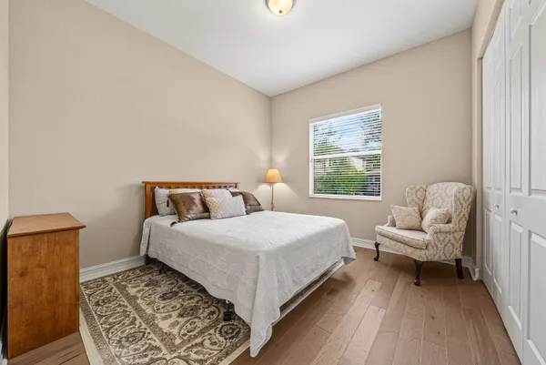 a bedroom with a bed and a couch